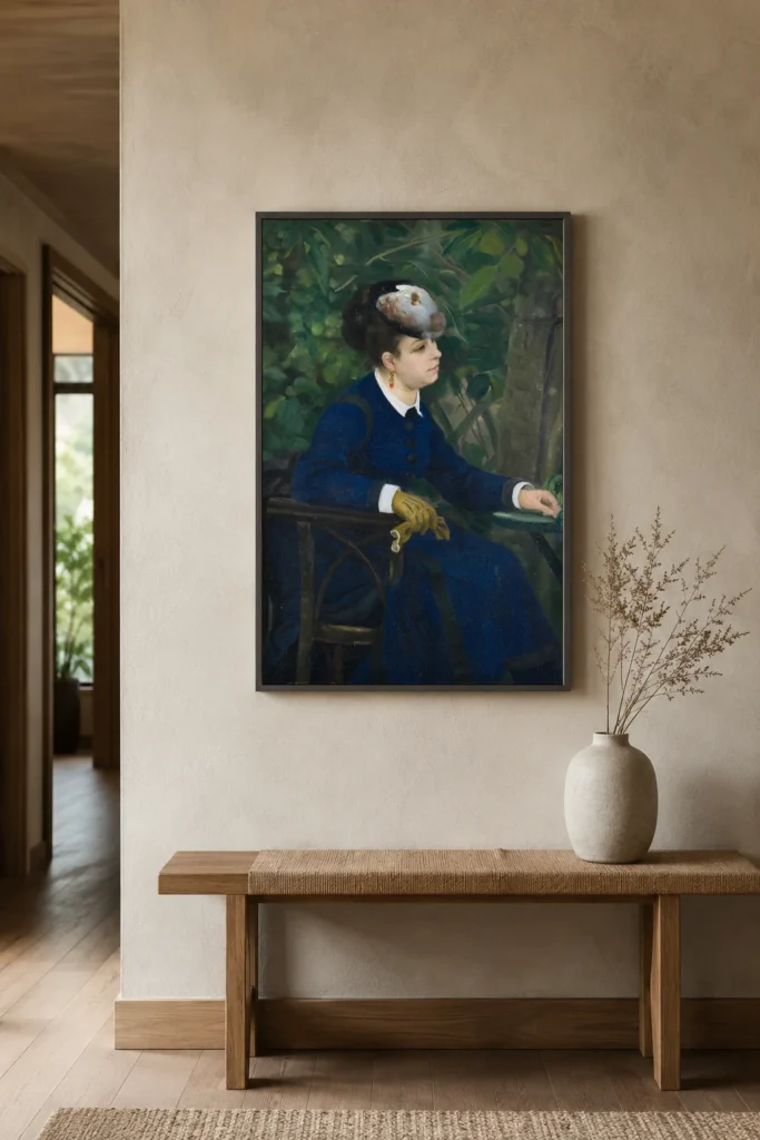 Framed print of Woman in a Garden hanging on a wall in a furnished room