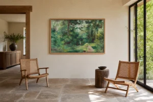 Framed print of Woman Reading in a Clearing hanging on a wall in a furnished room