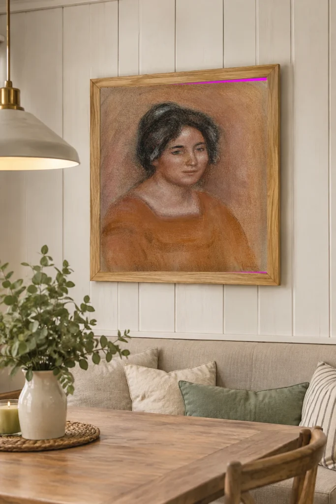Framed print of Gabrielle in an Orange Dress hanging on a wall in a furnished room