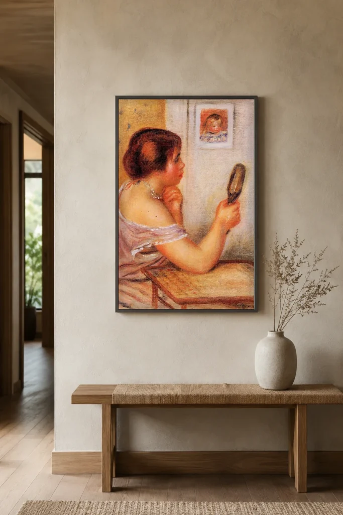 Framed print of Gabrielle Holding a Mirror with a Portrait of Coco hanging on a wall in a furnished room