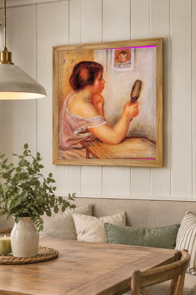 Framed print of Gabrielle Holding a Mirror with a Portrait of Coco hanging on a wall in a furnished room