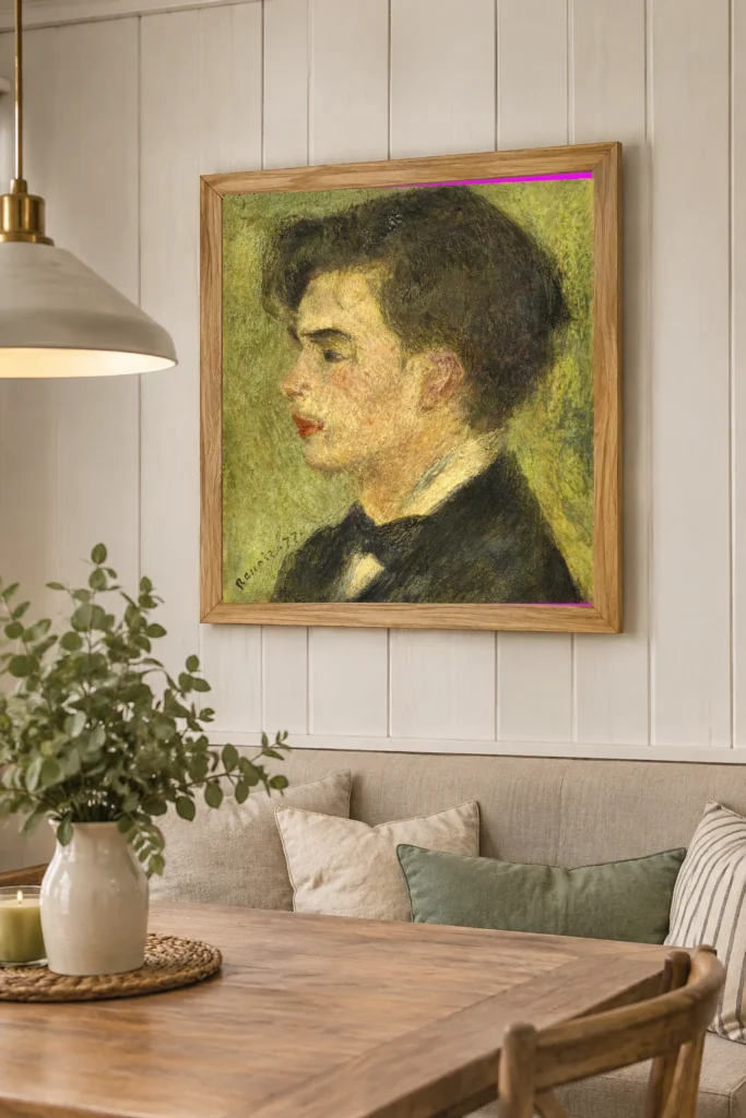 Framed print of Georges Rivière hanging on a wall in a furnished room