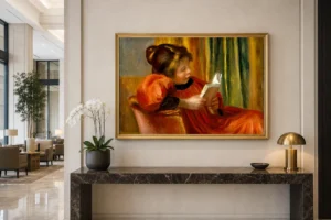 Framed print of Girl Reading hanging on a wall in a furnished room