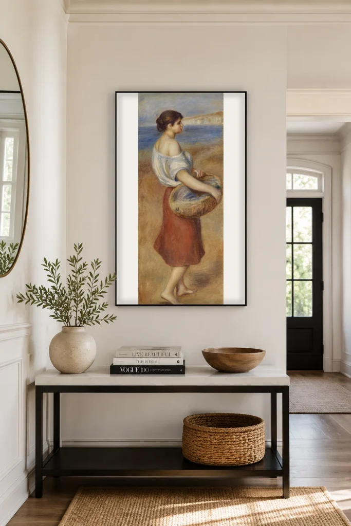 Framed print of Girl with Basket of Fish (Pêcheuse de poissons) hanging on a wall in a furnished room