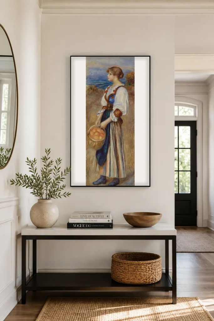 Framed print of Girl with Basket of Oranges (Marchande d’oranges) hanging on a wall in a furnished room