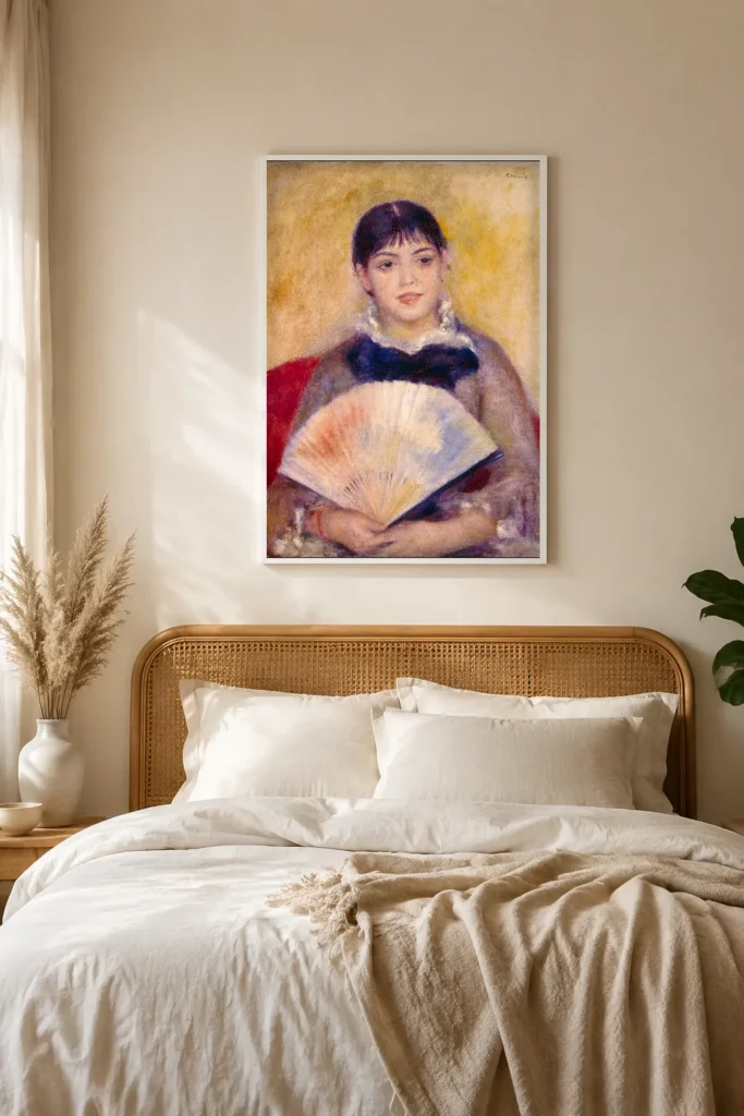 Framed print of Girl with a Fan hanging on a wall in a furnished room