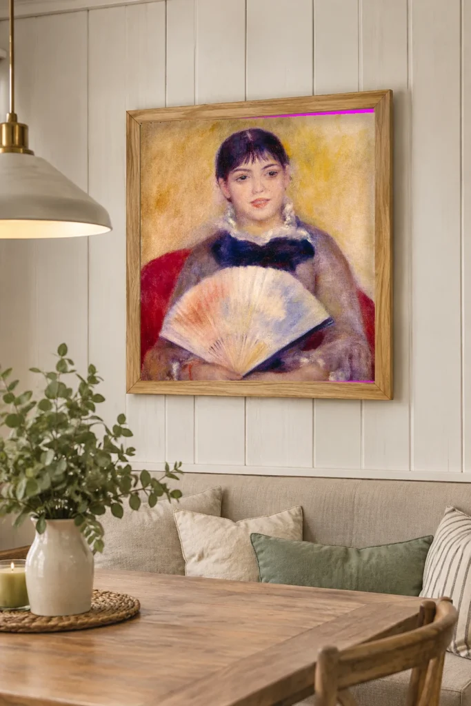 Framed print of Girl with a Fan hanging on a wall in a furnished room