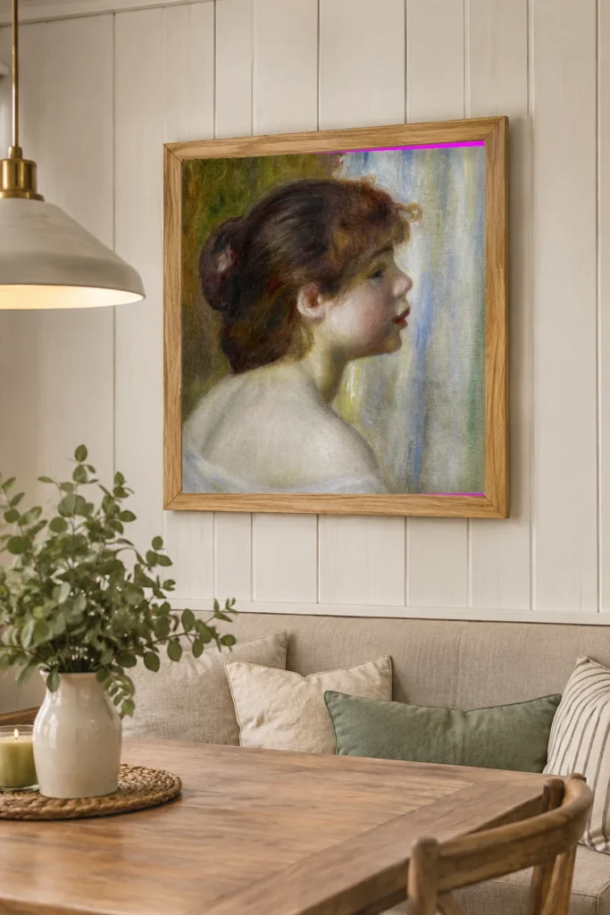 Framed print of Head of a Young Woman hanging on a wall in a furnished room
