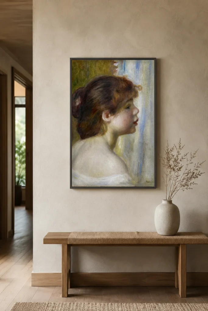 Framed print of Head of a Young Woman hanging on a wall in a furnished room
