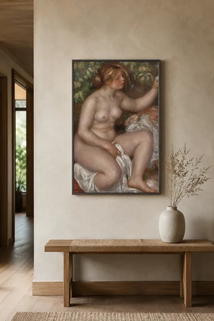 Framed print of After the Bath (La Sortie du bain) hanging on a wall in a furnished room