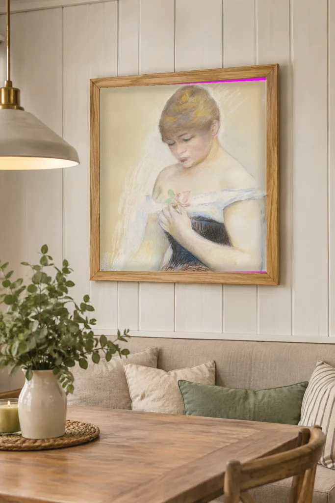 Framed print of Young Woman Holding a Flower (Portrait of Jeanne Samary) hanging on a wall in a furnished room