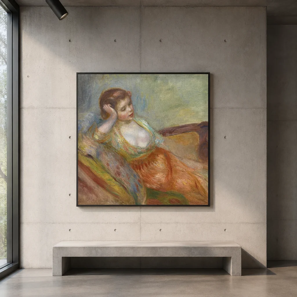 Framed print of Young Girl Seated on a Sofa hanging on a wall in a furnished room