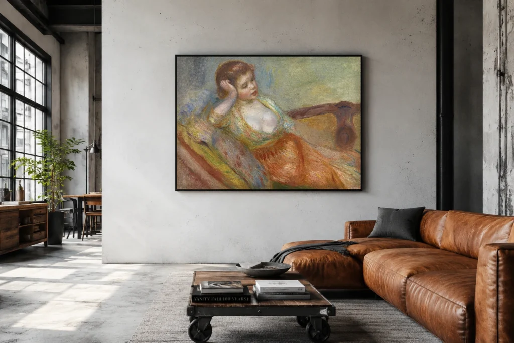 Framed print of Young Girl Seated on a Sofa hanging on a wall in a furnished room