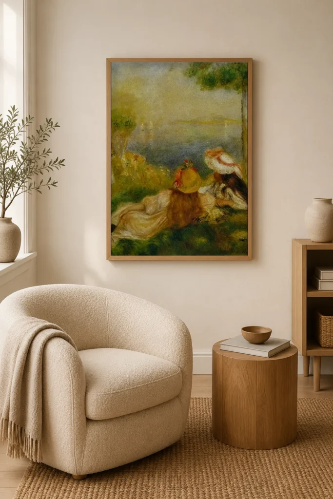Framed print of Young Girls by the Sea hanging on a wall in a furnished room