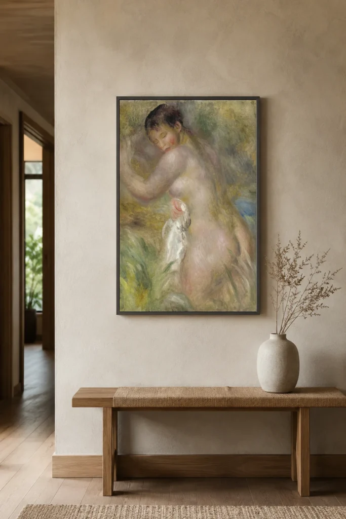 Framed print of The Bather hanging on a wall in a furnished room