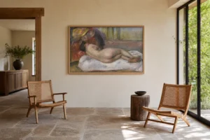 Framed print of The Rest hanging on a wall in a furnished room