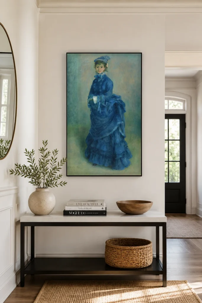 Framed print of La Parisienne hanging on a wall in a furnished room
