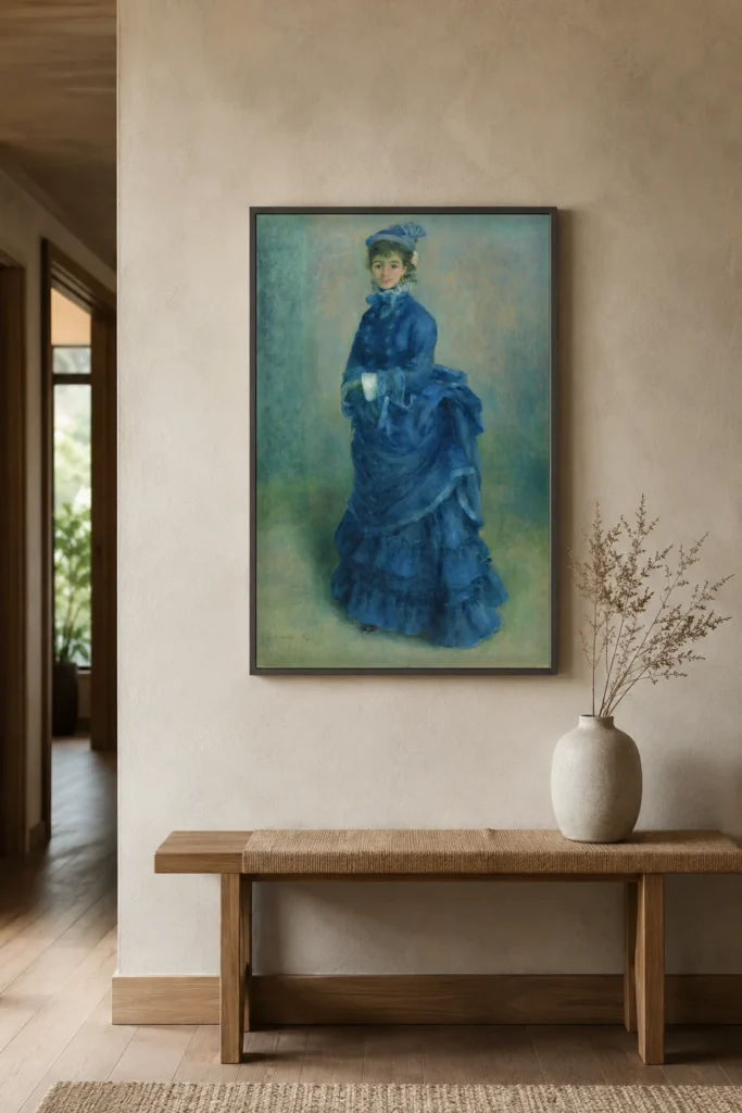 Framed print of La Parisienne hanging on a wall in a furnished room