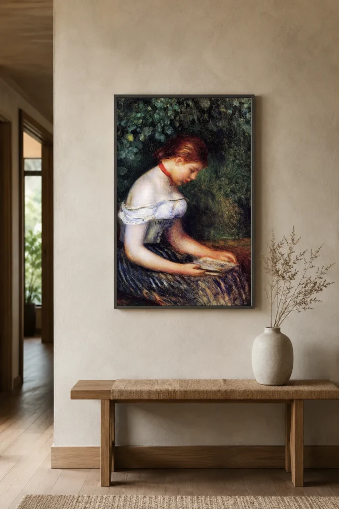 Framed print of The Reader, Seated Woman hanging on a wall in a furnished room