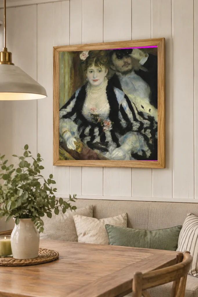 Framed print of La loge hanging on a wall in a furnished room