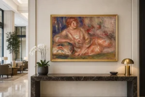 Framed print of Andrée in Pink, Reclining (Andrée en rose étendue) hanging on a wall in a furnished room