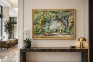 Framed print of Les Collettes hanging on a wall in a furnished room