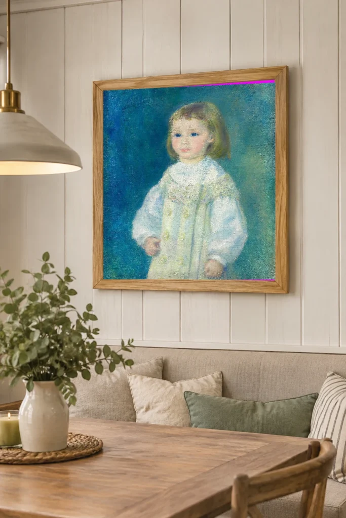 Framed print of Lucie Berard (Child in White) hanging on a wall in a furnished room
