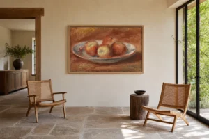 Framed print of Apples (Pommes) hanging on a wall in a furnished room