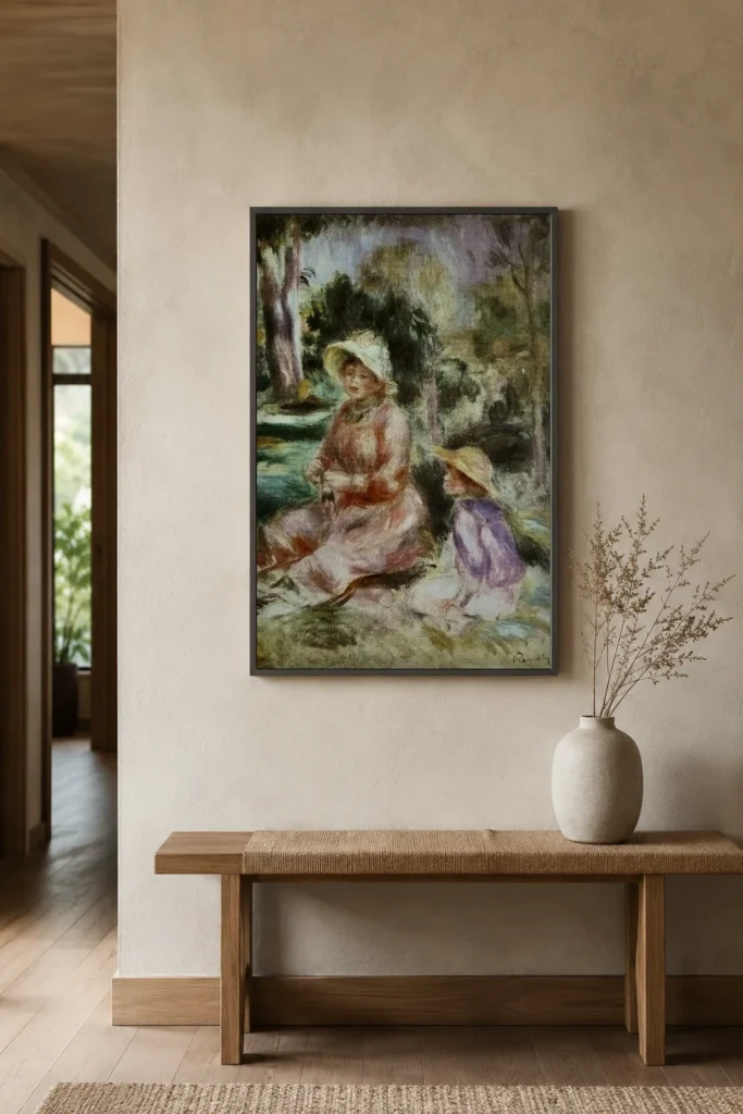 Framed print of Madame Renoir and Her Son Pierre hanging on a wall in a furnished room