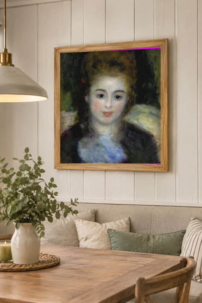 Framed print of Mademoiselle Henriot hanging on a wall in a furnished room