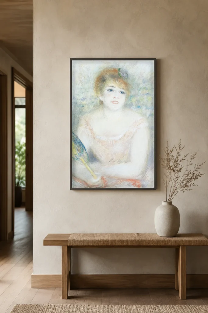Framed print of Mlle. Jeanne Samary hanging on a wall in a furnished room