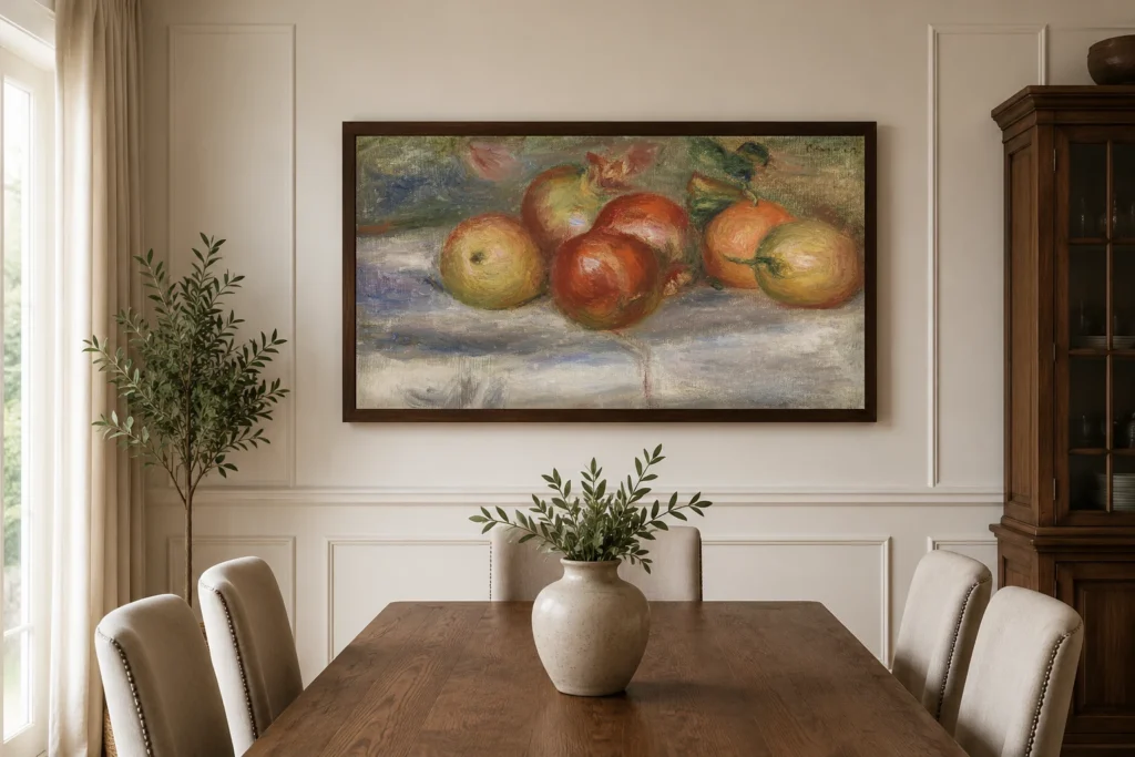 Framed print of Apples, Orange, and Lemon (Pommes, oranges et citrons) hanging on a wall in a furnished room