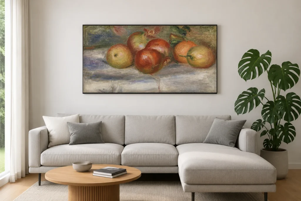Framed print of Apples, Orange, and Lemon (Pommes, oranges et citrons) hanging on a wall in a furnished room