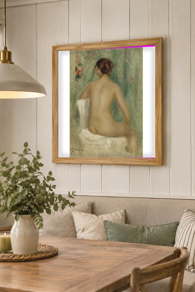 Framed print of Seated Nude, Seen from Behind hanging on a wall in a furnished room