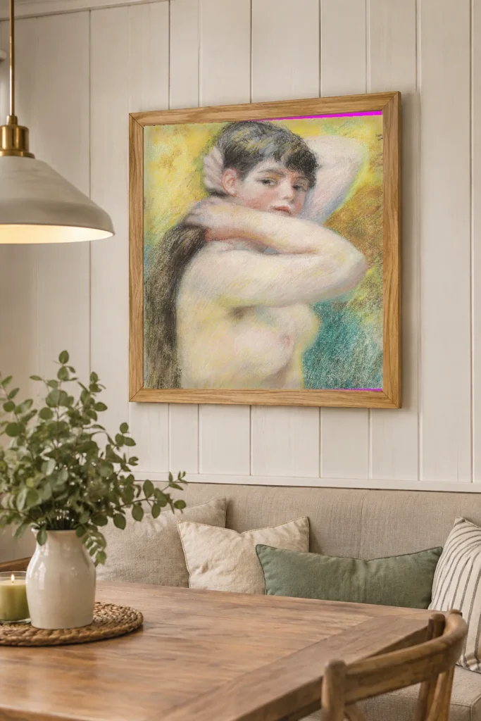 Framed print of Nude Arranging Her Hair hanging on a wall in a furnished room