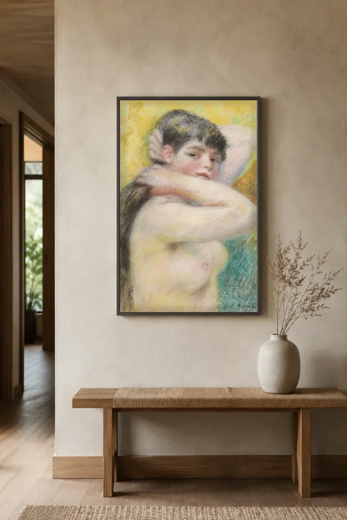 Framed print of Nude Arranging Her Hair hanging on a wall in a furnished room