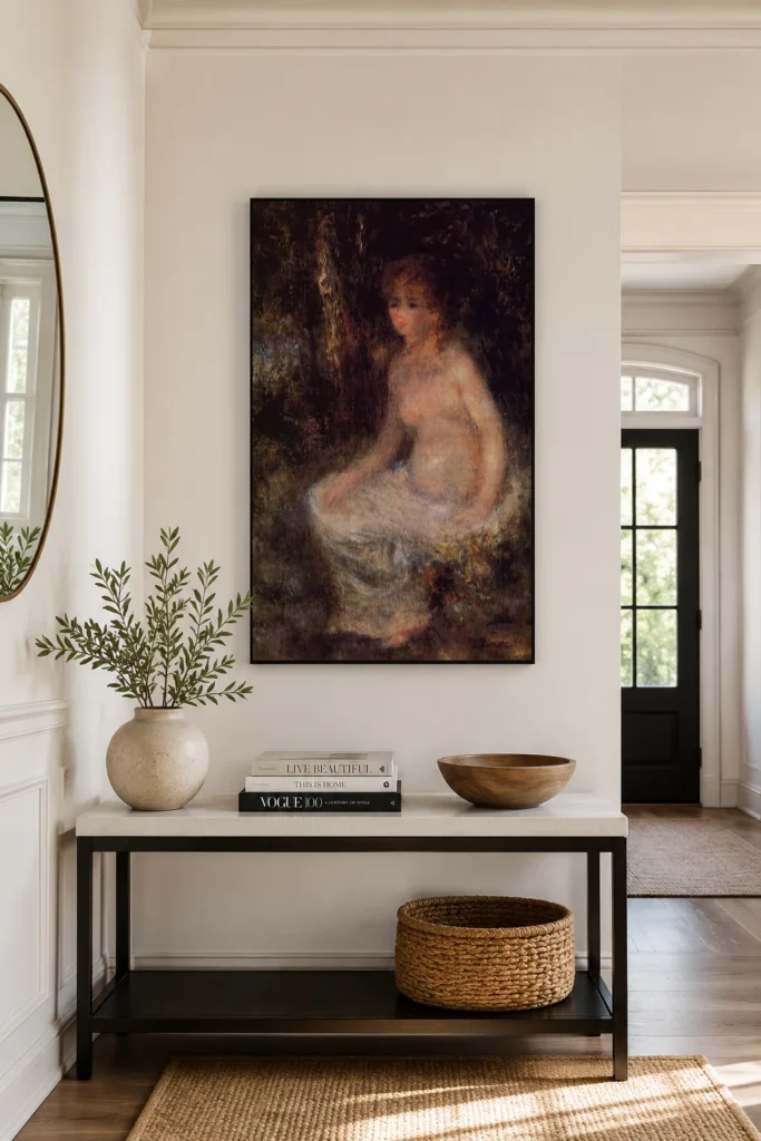 Framed print of Seated Nude in the Forest hanging on a wall in a furnished room