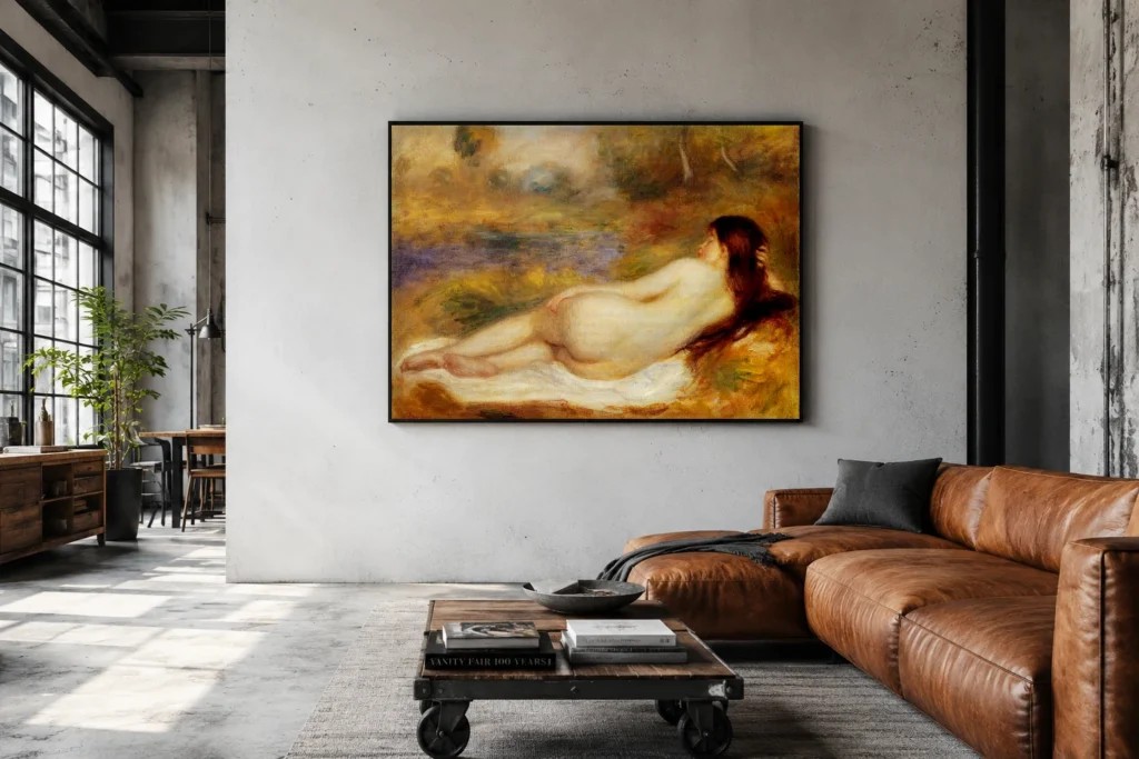 Framed print of Reclining Nude on the Grass hanging on a wall in a furnished room