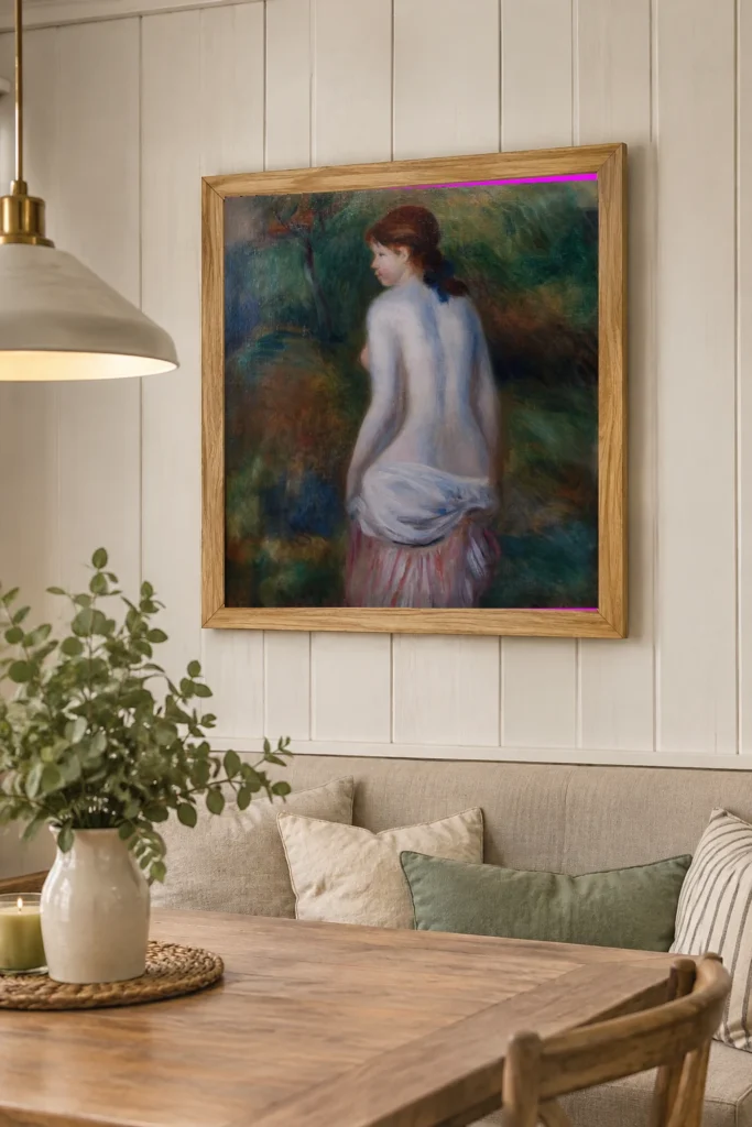 Framed print of Nude in a Landscape hanging on a wall in a furnished room