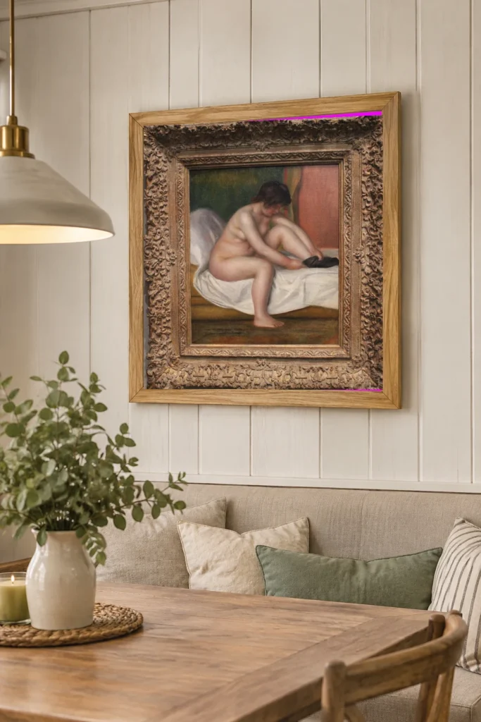 Framed print of Nude hanging on a wall in a furnished room