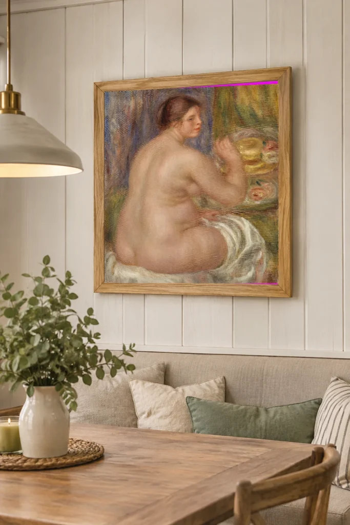 Framed print of Nude from the Back (Nu de dos) hanging on a wall in a furnished room