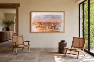 Framed print of Landscape at Dusk hanging on a wall in a furnished room