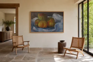 Framed print of Pommes et poires hanging on a wall in a furnished room