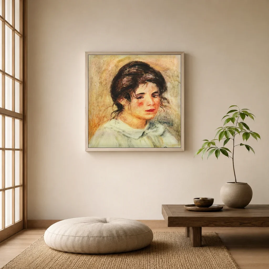 Framed print of Portrait of Gabrielle in a White Blouse hanging on a wall in a furnished room