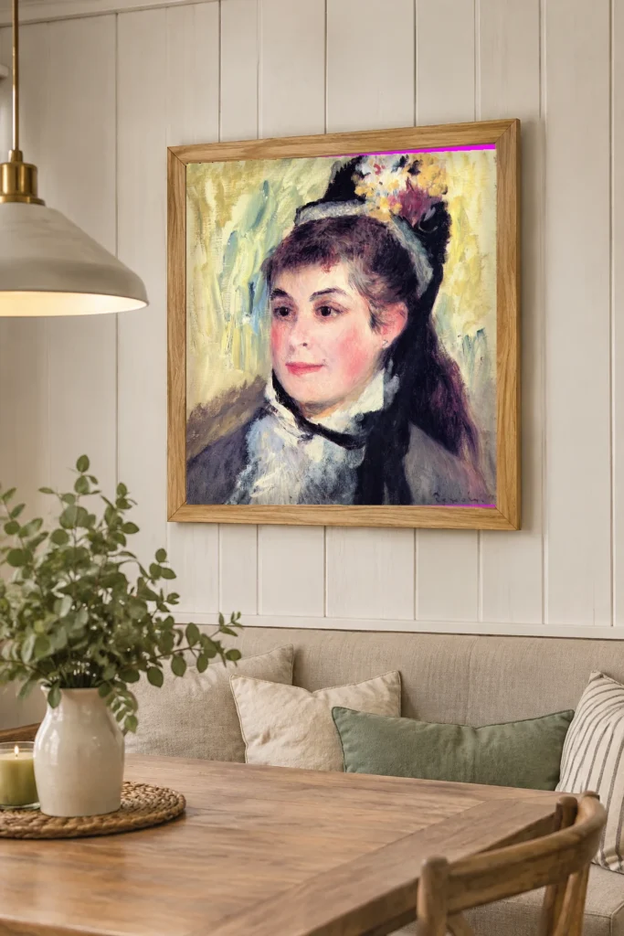 Framed print of Portrait of Madame Edmond Renoir hanging on a wall in a furnished room