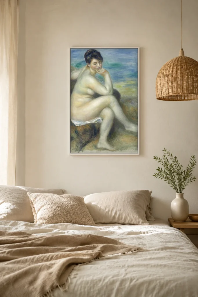 Framed print of Bather Leaning on Her Elbow hanging on a wall in a furnished room