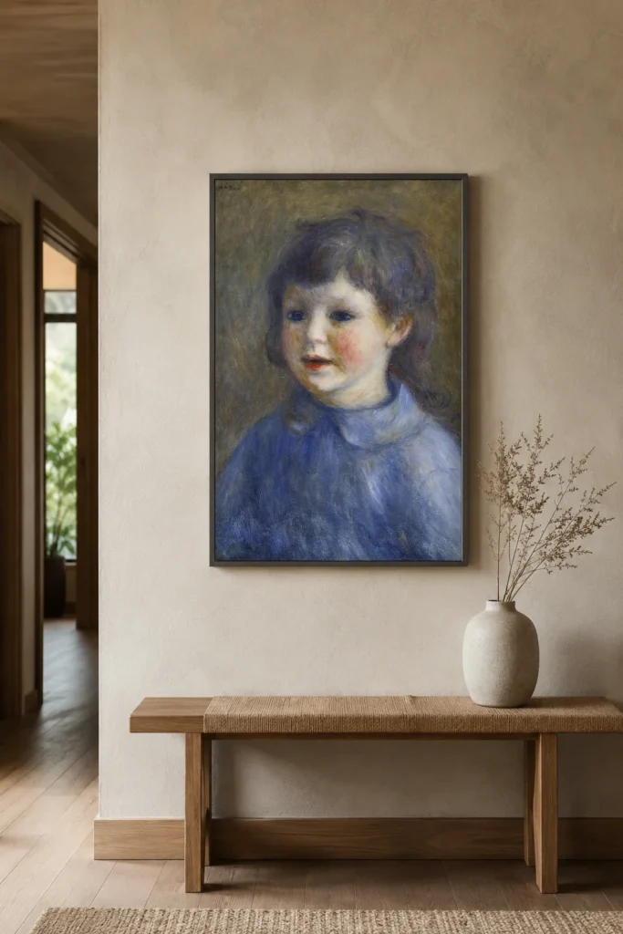 Framed print of Portrait of Pierre Renoir hanging on a wall in a furnished room