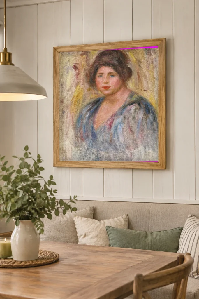 Framed print of Portrait of a Woman (Gabrielle Renard) hanging on a wall in a furnished room