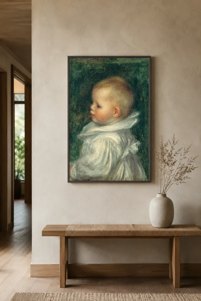 Framed print of Portrait of Claude Renoir hanging on a wall in a furnished room