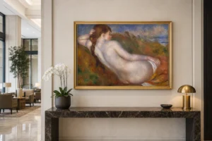 Framed print of Reclining Nude hanging on a wall in a furnished room